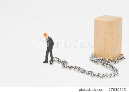 A businessman connected to a chain A businessman connected to a chain 27050525