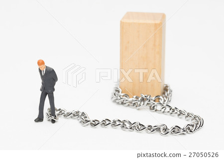A businessman connected to a chain A businessman connected to a chain 27050526