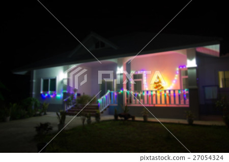 blurred house decorated with lights for Christmas blurred house decorated with lights for Christmas 27054324