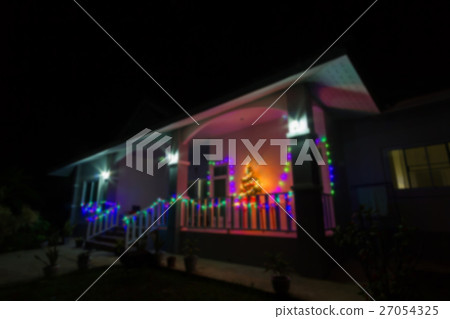 blurred house decorated with lights for Christmas blurred house decorated with lights for Christmas 27054325