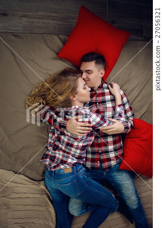 young couple boy and girl in checkered shirts young couple boy and girl in checkered shirts 27056321