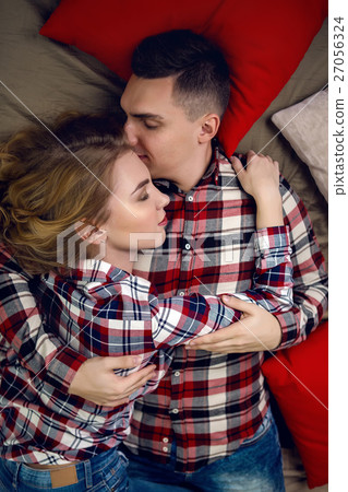 young couple boy and girl in checkered shirts 27056324