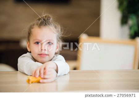 Thoughtful portrait of little girl lay on the Thoughtful portrait of little girl lay on the 27056971