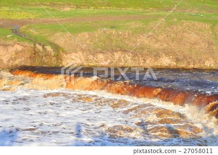 Small waterfall on river. Small waterfall on river. 27058011