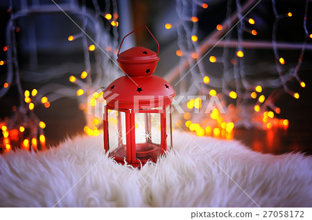 Red candle holder with a stands on white skin Red candle holder with a stands on white skin 27058172