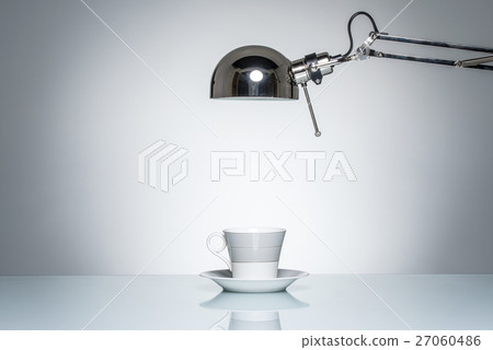 lighting up white mug coffee cup with desk lamp lighting up white mug coffee cup with desk lamp 27060486