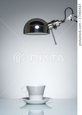 lighting up white mug coffee cup with desk lamp lighting up white mug coffee cup with desk lamp 27060487
