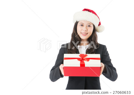 Christmas business woman smiling holding present 27060633