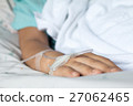 Focus on the hand of a patient in hospital ward 27062465