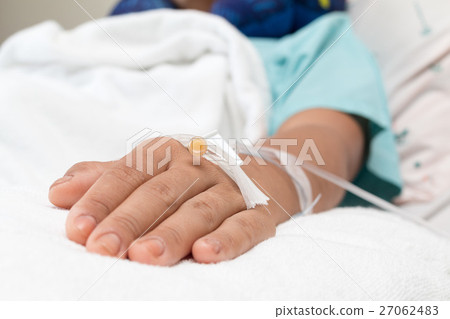 Focus on the hand of a patient in hospital ward 27062483