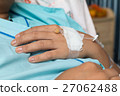 Focus on the hand of a patient in hospital ward 27062488