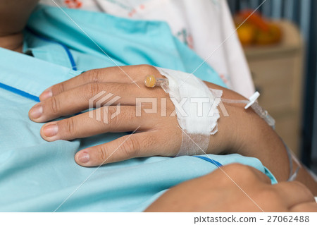 Focus on the hand of a patient in hospital ward 27062488
