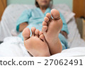 Feet of a young woman (Patient) sick  relax in bed 27062491