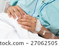 Focus on the hand of a patient in hospital ward 27062505
