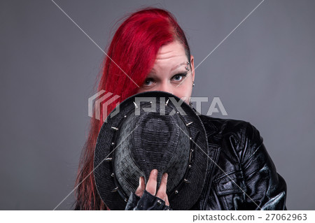 Guilty rock woman in black hat 27062963