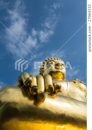 Big golden buddha statue with blue sky at Golden T 27064555
