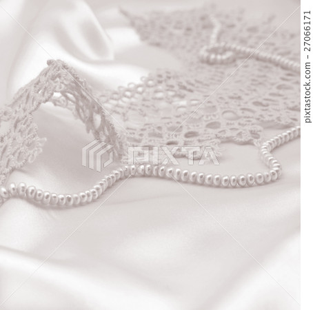 Smooth elegant golden silk or satin with pearls Smooth elegant golden silk or satin with pearls 27066171