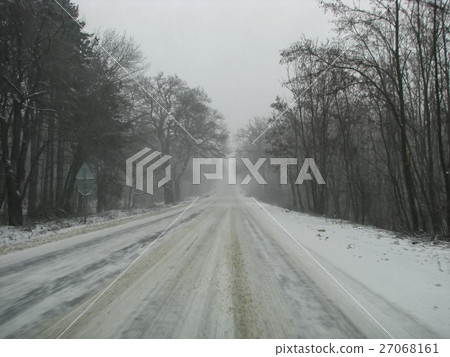 Side road in the forest during the winter season Side road in the forest during the winter season 27068161