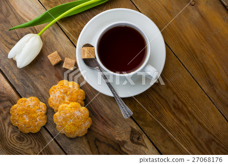 Cup of tea and crumbly homemade cookies top view Cup of tea and crumbly homemade cookies top view 27068176