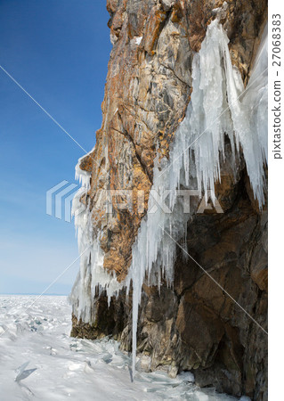 Huge icicles on rocks. Beautiful winter landscape Huge icicles on rocks. Beautiful winter landscape 27068383