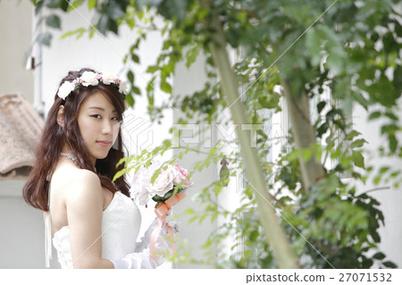 Young woman in a wedding dress Young woman in a wedding dress 27071532