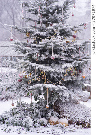 Decorated Christmas Tree at snow winter weather 27071974
