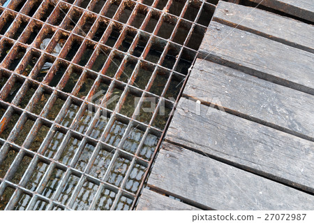 Sewer rusty steel and wood cover water drainage 27072987