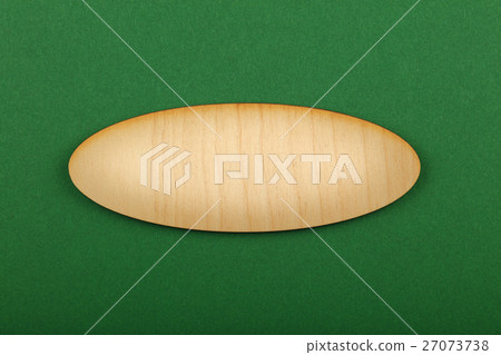 Ellipse shaped wooden sign on green background Ellipse shaped wooden sign on green background 27073738