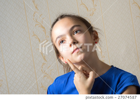 girl thoughtfully looking up 27074587