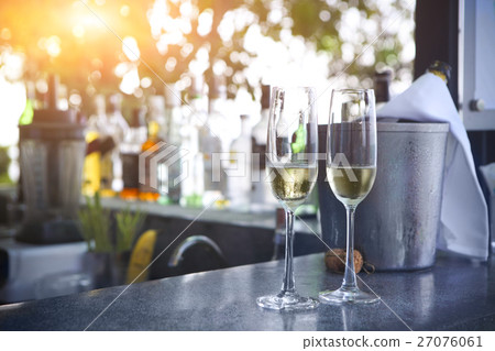 Glasses of champagne in outdoor resort bar 27076061