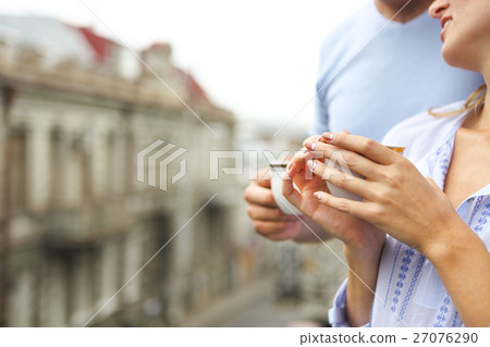 Happy young beautiful couple drinking coffee 27076290