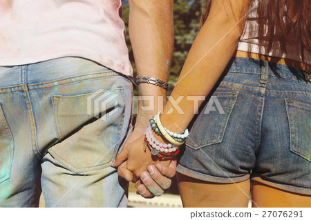 Happy couple in love on holi color festival Happy couple in love on holi color festival 27076291