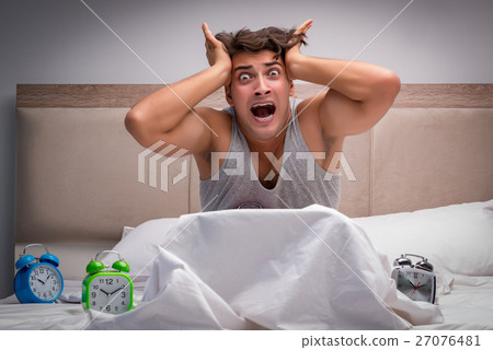 Man having trouble waking up in the morning 27076481