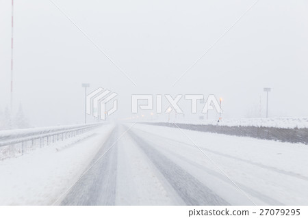A snowy midwinter highway 27079295