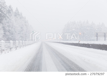 A snowy midwinter highway 27079297