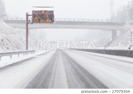 A snowy midwinter highway A snowy midwinter highway 27079304