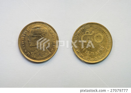 Old Thai coin on white background Old Thai coin on white background 27079777