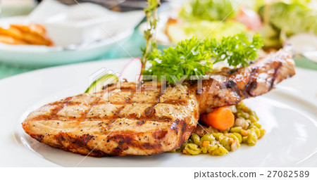 grilled porkchop on plate 27082589