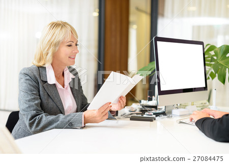 Happy senior lady buying cosmetology in shop Happy senior lady buying cosmetology in shop 27084475