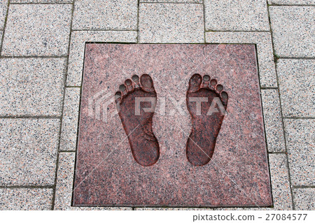 imprint of a foot on a stone imprint of a foot on a stone 27084577