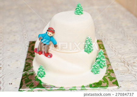 Mastic cake in mountain form with skier 27084737
