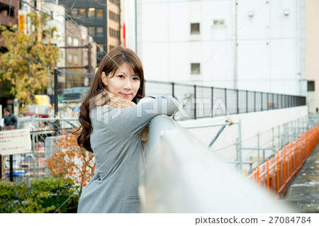 A woman looking at the Kanda River A woman looking at the Kanda River 27084784