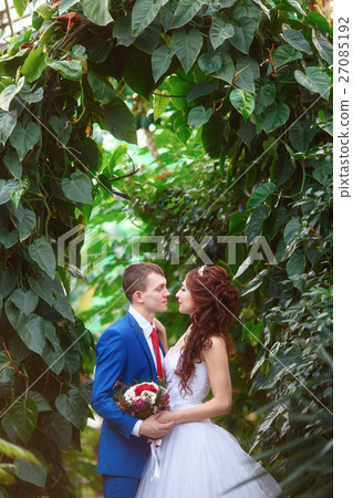 Wedding. Happy bride and groom together in garden Wedding. Happy bride and groom together in garden 27085192
