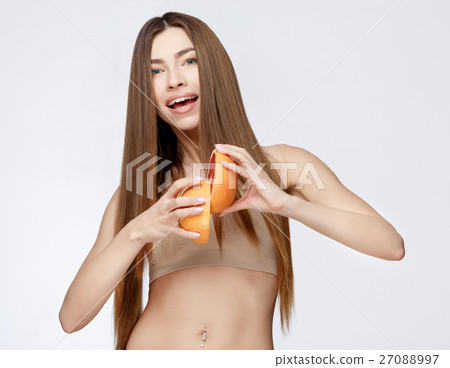 Beautiful Woman with Clean Fresh Skin holding Beautiful Woman with Clean Fresh Skin holding 27088997