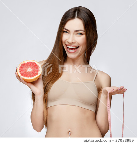 Beautiful Woman with Clean Fresh Skin holding Beautiful Woman with Clean Fresh Skin holding 27088999