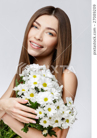 Beautiful Woman with Clean Fresh Skin holding Beautiful Woman with Clean Fresh Skin holding 27089209