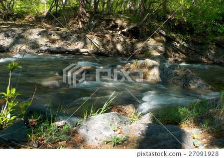 River amongst stone in valley mountains 27091928
