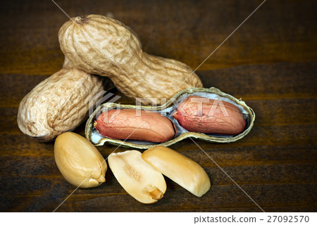 Peanuts in Shells on Wooden Table Peanuts in Shells on Wooden Table 27092570