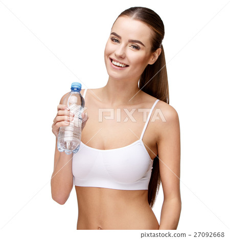 attractivesmiling woman holding bottle of water 27092668