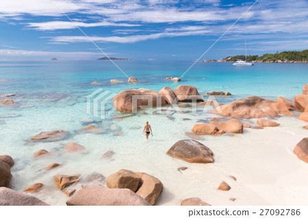 Woman enjoying Anse Lazio picture perfect beach on 27092786